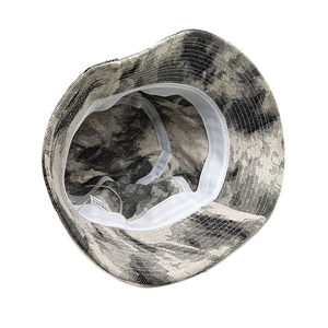 Ink-wash style tie-dye bucket hat with interior view showing white sweatband and label