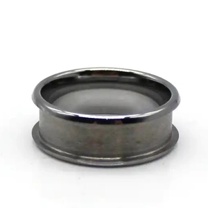 Detail view of a black tungsten steel ring blank with a beveled edge for jewelry making