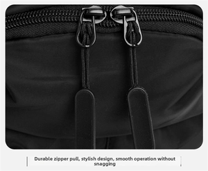 Close-up of durable dual-way zippers with ergonomic pull cords on black oxford chest bag