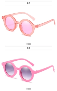 Detail view of round frame kids sunglasses in C2 pink and C3 solid pink colors