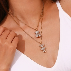 Double layered 18K gold plated necklace featuring a bear pendant with sparkling crystals