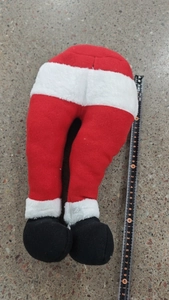 Detailed view of 40cm plush Santa legs decoration measured with a black tape ruler