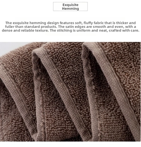 Close-up of brown thick cotton towel showing dense soft texture and satin border detail