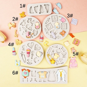 Baby themed silicone mold set for cake decorating featuring baby shoes and blocks