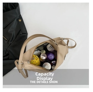 Top view of spacious beige tote bag interior showing umbrella and cosmetics storage