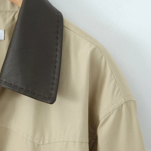 Vintage khaki trench coat with contrast dark brown faux leather collar and topstitch detail