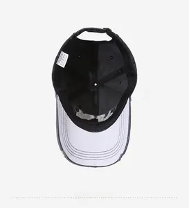 Internal detail of distressed baseball cap showing stitching and contrast lining