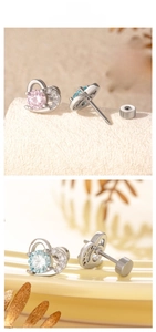 Macro detail of heart-shaped zircon earrings with secure screw back and crystal inlay