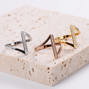 Elegant V-shaped geometric rings with cubic zirconia in silver, rose gold, and gold finishes
