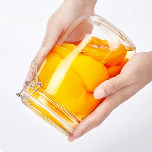 Sealed glass storage jar with metal lid lock and thick gasket for airtight food preservation