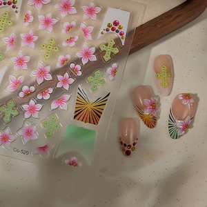 Macro view of gradient ice flower nail decals with cross and gemstone 3D textures