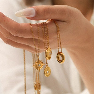 18K gold plated stainless steel layered necklace set with starburst and coin pendants