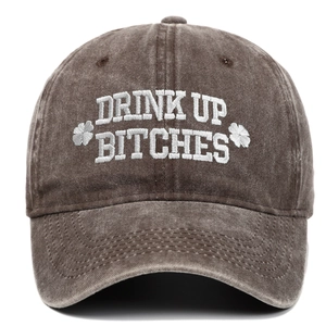 Close-up of vintage washed brown cotton baseball cap with white 3D clover embroidery