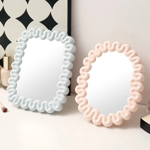 Minimalist wavy edge makeup mirrors in pastel blue and pink for desktop decor