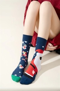 Close-up of festive navy and red Christmas cotton crew socks with snowman patterns