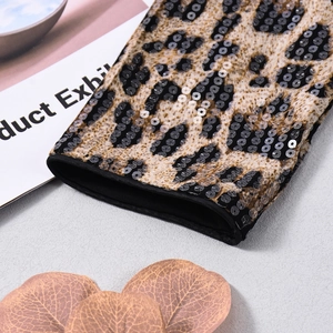 Detail shot of leopard print sleeve with shiny sequins and high-quality black stitched hem
