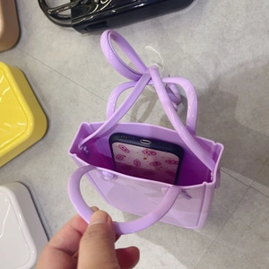 Detailed top view of purple PVC jelly tote bag showing interior space for a smartphone