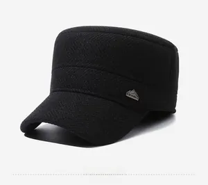 Detail shot of the black military cap showing twill fabric and metal mountain logo