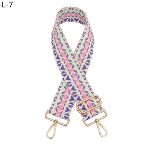 Close-up of geometric diamond woven strap with polished gold adjustable metal hooks