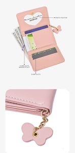 Pink fold-over wallet detail with multiple card slots and heart photo window