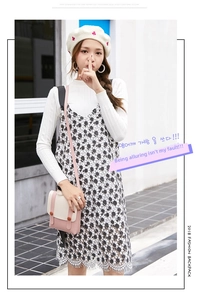 Close-up of small pink and cream square crossbody bag worn by model in street fashion