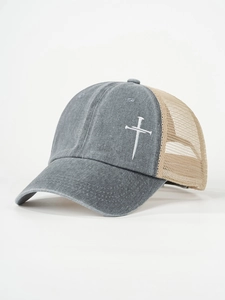 Detailed embroidery of a white cross on grey washed cotton and khaki mesh trucker hat
