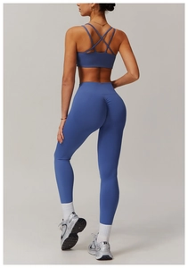 Back view of yoga set featuring criss-cross back sports bra and high-waist scrunch leggings