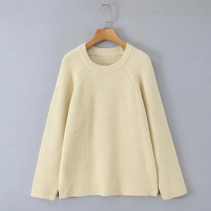 Detailed knit texture and raglan sleeve design on a beige crewneck sweater