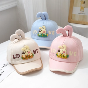 Three cute baby baseball hats with bunny ears in beige, blue and pink colors