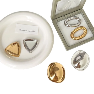 Minimalist geometric stainless steel brooches in gold and silver finish in a set