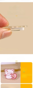 Detail of 4mm thick acrylic brooch showing the sandwich print design and smooth edges