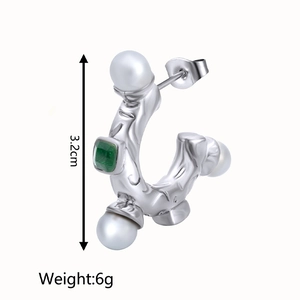 Detail view of C-shaped silver earring with pearls, green gemstone, size and weight specs