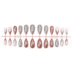 Maillard almond press-on nails with silver moon and star designs on red and grey