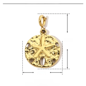 Detailed macro view of gold sand dollar pendant showing 15mm by 23mm dimensions