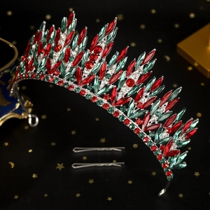 Detailed macro view of silver tiara featuring red and green gems for Christmas parties