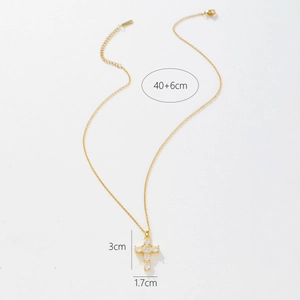 Detail showing gold cross pendant with white crystals and adjustable 40+6cm chain
