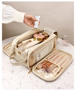 Detail of beige PU leather toiletry bag with large capacity for makeup brushes