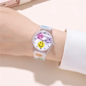 Detailed close-up of transparent watch band and dial with colorful smiley face patterns