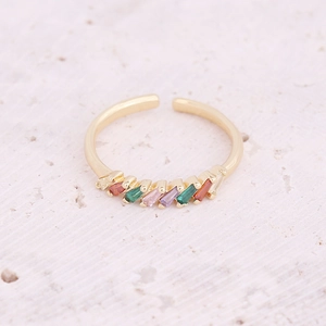 Close-up of golden adjustable ring with multicolored rectangular cubic zirconia stones