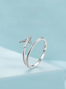 Macro view of S925 sterling silver airplane ring featuring micro-pave cubic zirconia wing