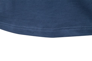 Detail view of the navy blue knit cotton hem with uniform double-needle stitching