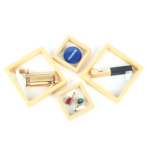 Set of four beige PE film floating jewelry display boxes in different sizes for storage
