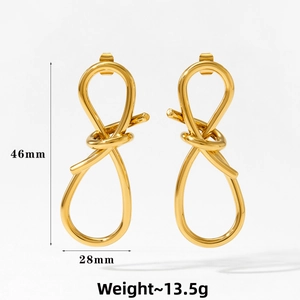 Detail view of gold knot earrings showing dimensions 46mm by 28mm and weight 13.5g