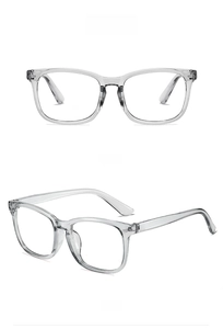 Detail view of transparent grey square glasses frame with rivet accents and clear lenses