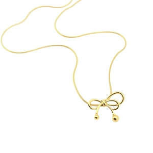 Elegant gold bow pendant necklace with a minimalist snake chain design on white background