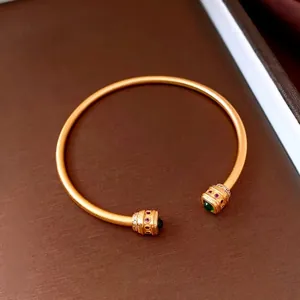 Vintage gold matte open cuff bracelet with green zircon and red gemstone accents