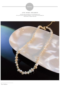 Detail of baroque irregular freshwater pearl necklace with golden adjustable clasp