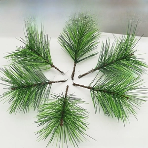 Close-up of artificial pine needles set for Christmas wreaths and DIY floral decor