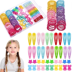 Detail set of colorful elastic hair ties and clips with transparent storage box