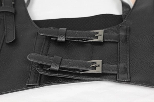 Detail of black leather corset belt showing dual metal buckles and premium stitching texture